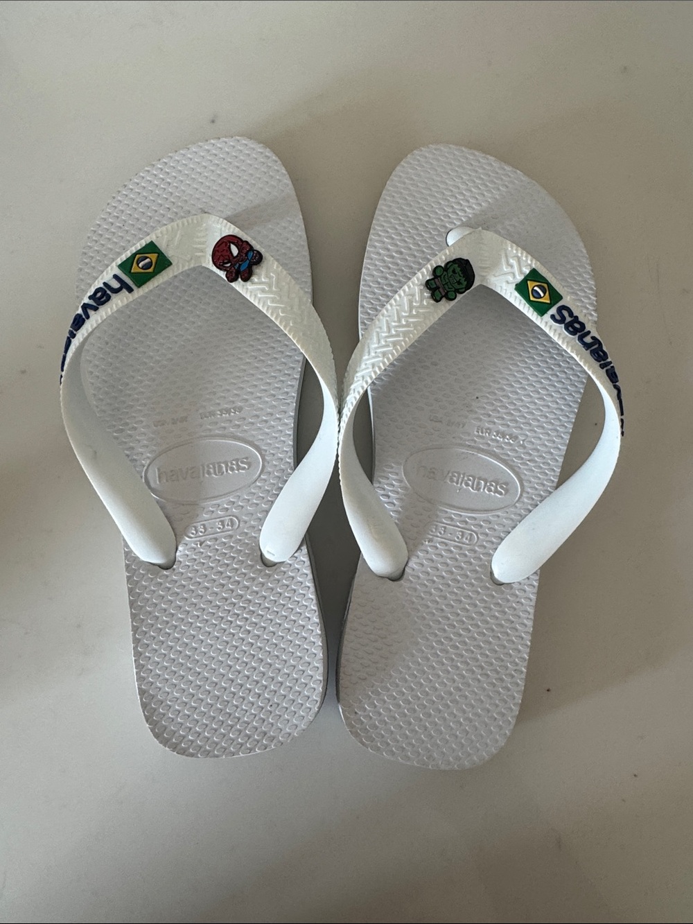 Havaianas Kids White Flip Flops with Brazil Flag and Superhero Charms